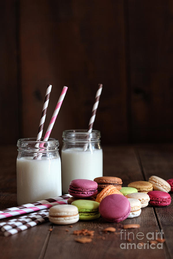 Glass jars with straws and macaroons Photograph by Sandra Cunningham