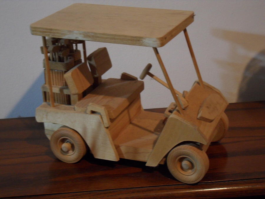 Golfcart Sculpture by Val Oconnor
