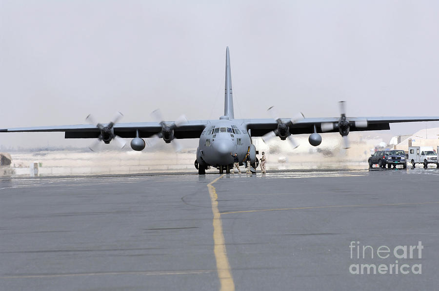 Airplane Photograph - Ground Crews Prepare A C-130 Hercules by Stocktrek Images