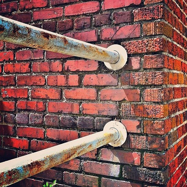 Grungy Red Bricks And Rusty White Pipes Photograph by Todd Mahan