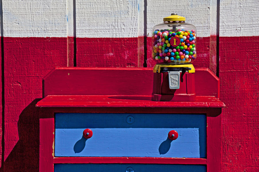 Vintage Photograph - Gum ball machine on red desk by Garry Gay