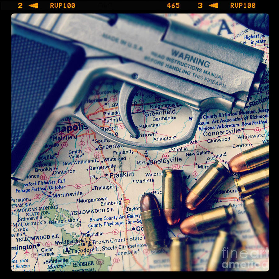 Gun and Bullets on Map Photograph by Jill Battaglia
