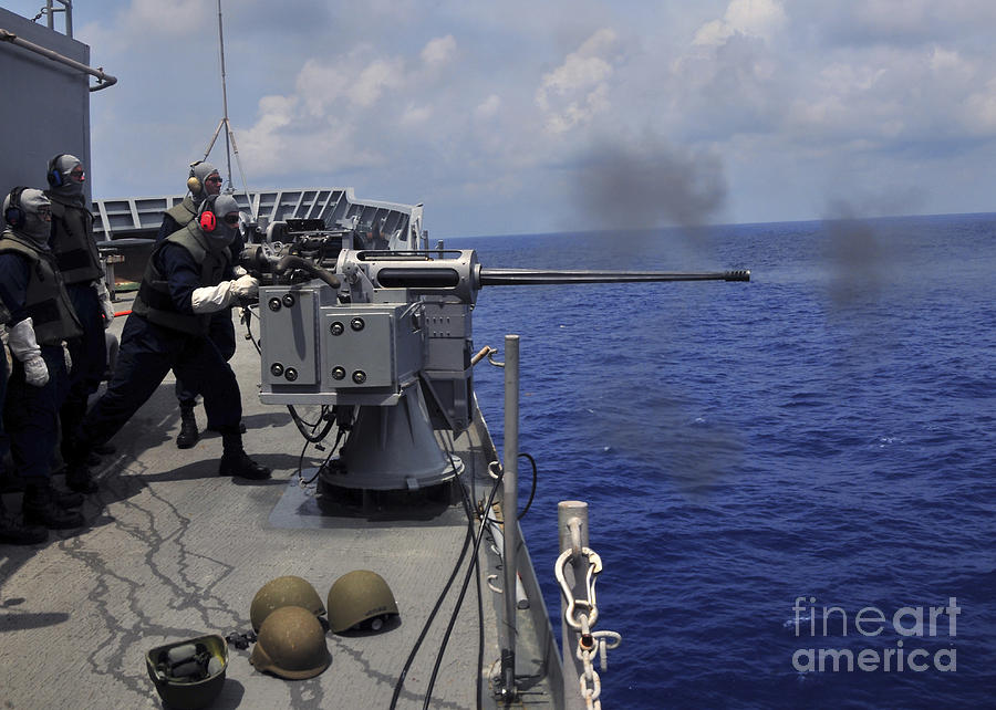 Gunner Fires A Mark 38 Machine Gun Photograph By Stocktrek Images