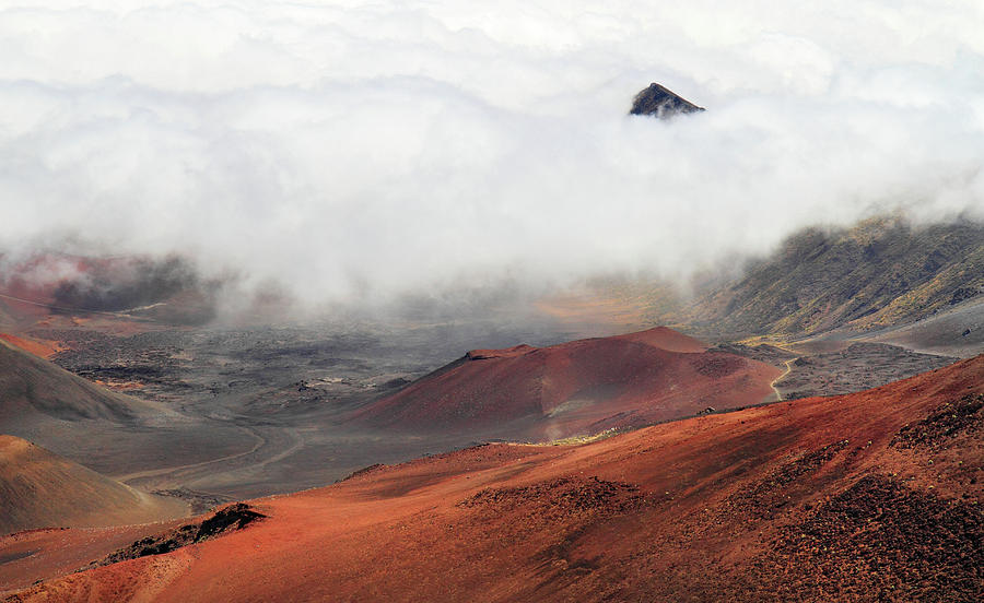 Haleakala Peaking above the clouds Photograph by Pierre Leclerc Photography