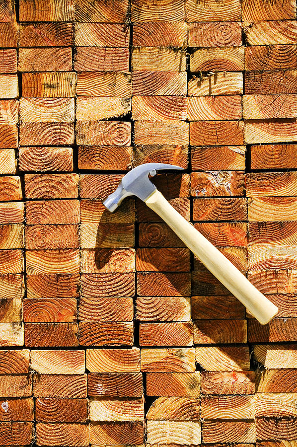 Hammer and stack of lumber Photograph by Garry Gay