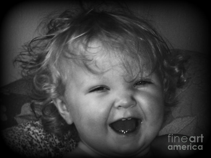 Black And White Photograph - Happiness in a babys smile by Christy Beal