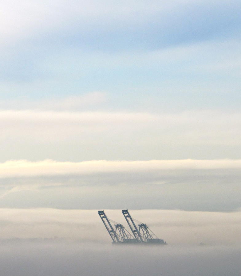 Harbor cranes in fog Photograph by Sean Griffin