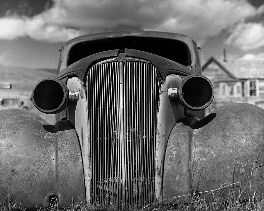 Headlights and Grill with Clouds Photograph by Joe  Palermo