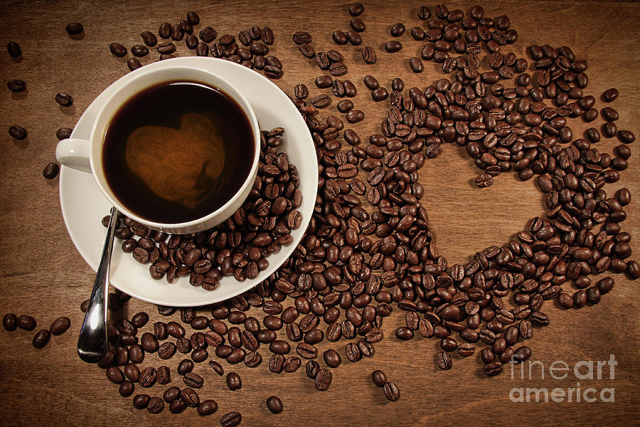 Heart shape from coffee beans on wood Photograph by Sandra Cunningham