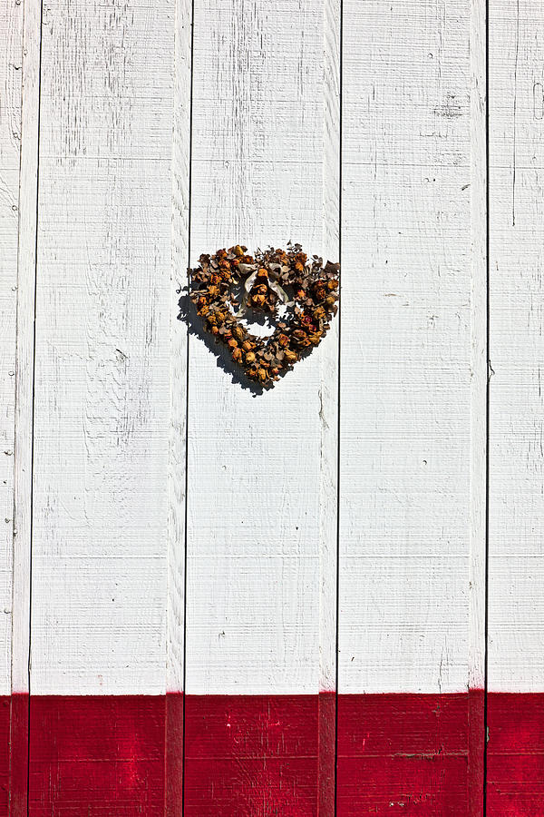 Heart wreath on wood wall Photograph by Garry Gay