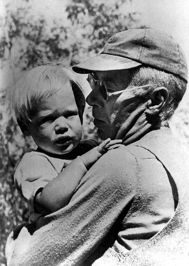 Father Photograph - Henry Miller Holding His Son Tony by Everett