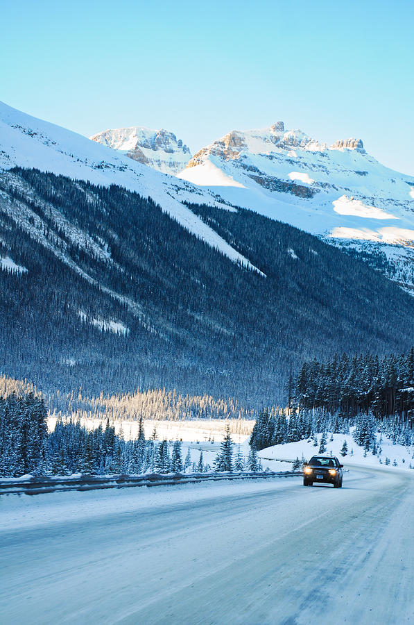 Highway in Winter through mountains Photograph by U Schade