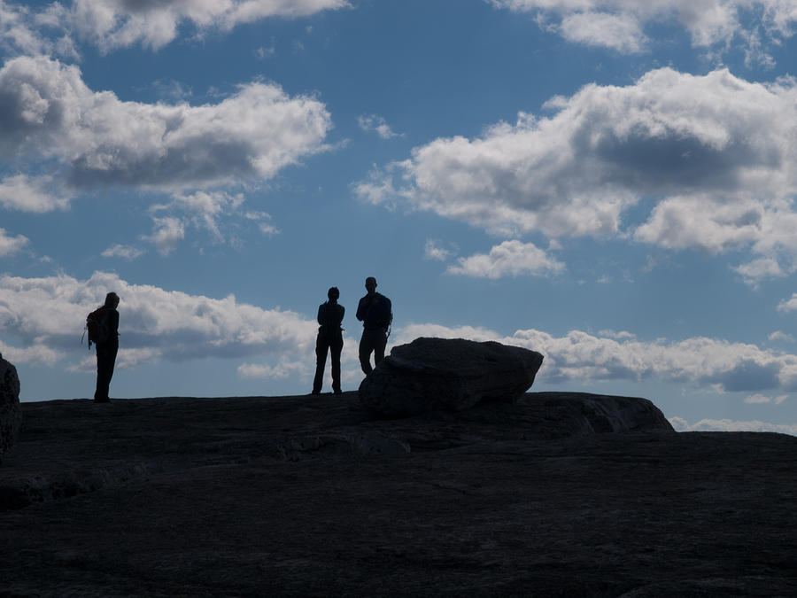 Hikers on Cliff Top Photograph by Jim DeLillo