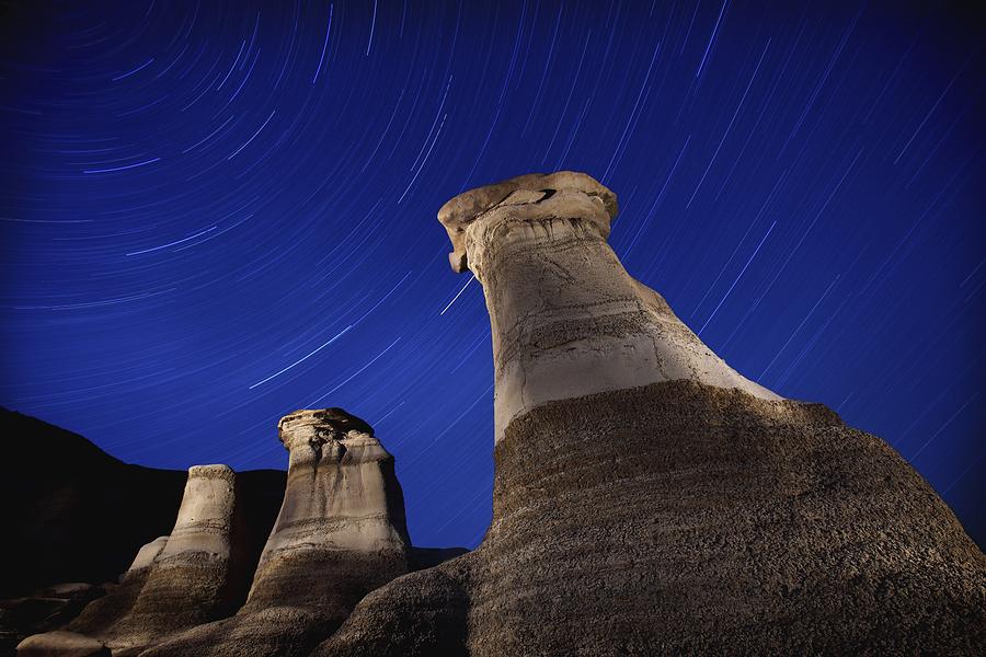 Nature Photograph - Hoodoos And Star Trails In The Sky by Richard Wear