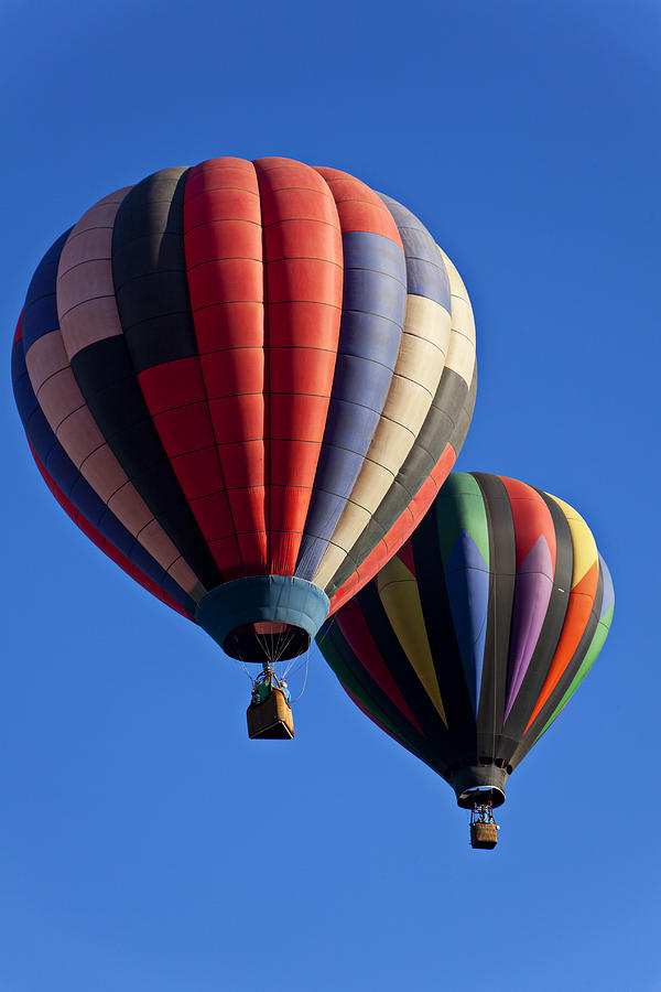 Hot air ballons floating high Photograph by Garry Gay