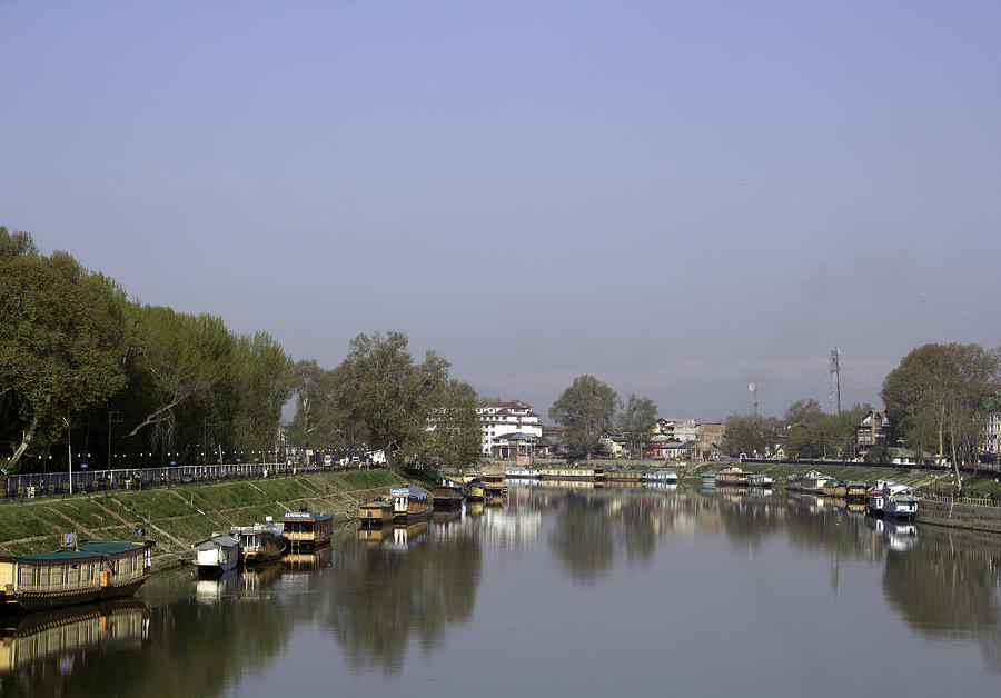 Houseboats on the shore of a canal in Srinagar Photograph by Ashish Agarwal