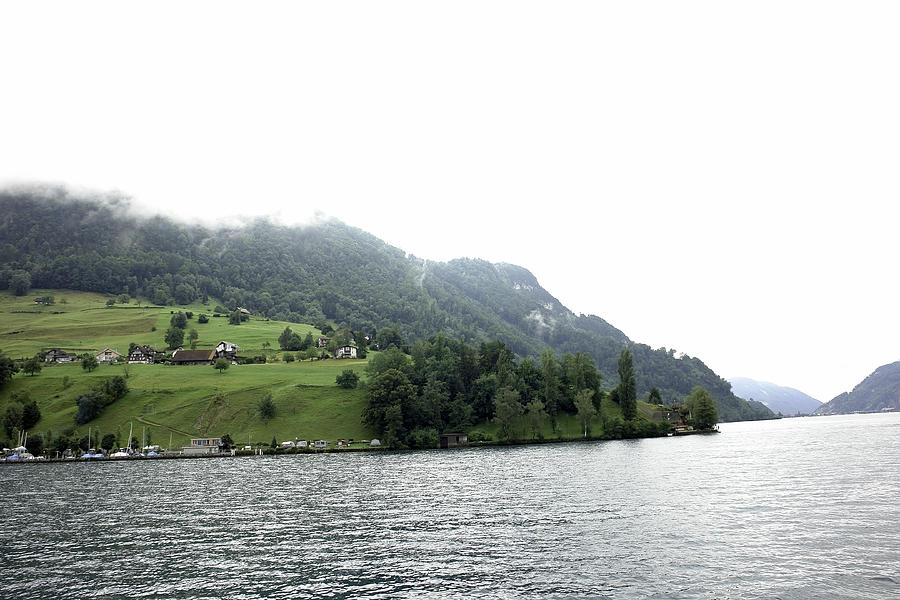 Houses on the slope of a mountain next to Lake Lucerne Photograph by Ashish Agarwal