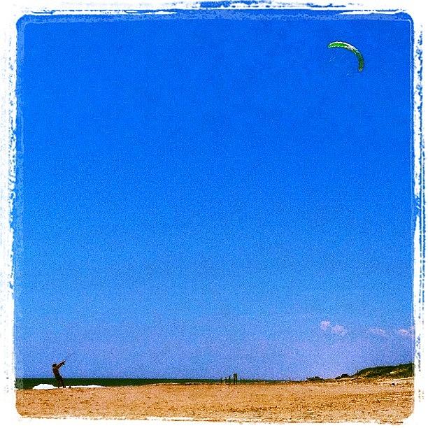 Summer Photograph - Hubby Flying A #kite On The #beach In by Mariana L