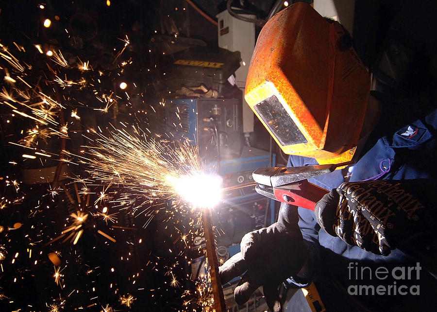 Horizontal Photograph - Hull Technician Practices Cutting Metal by Stocktrek Images