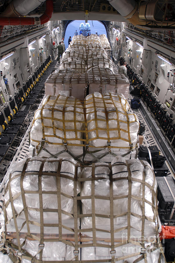 Transportation Photograph - Humanitarian Aid Supplies Loaded by Stocktrek Images