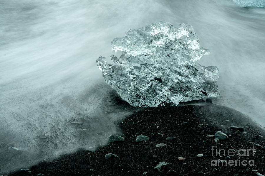 Iceberg on black sand beach Photograph by Levin Rodriguez