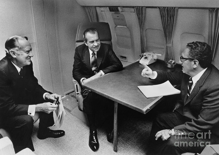 Richard Nixon Photograph - In Flight Discussion, President Nixon & by Photo Researchers