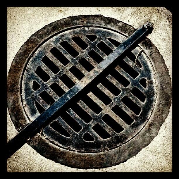 Edited Photograph - In My Backyard. #grate #metal #cement by Becca Watters