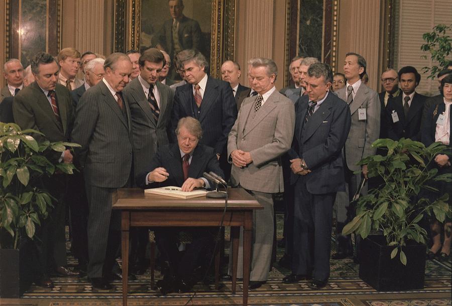 Jimmy Carter Signs A Social Security Photograph by Everett