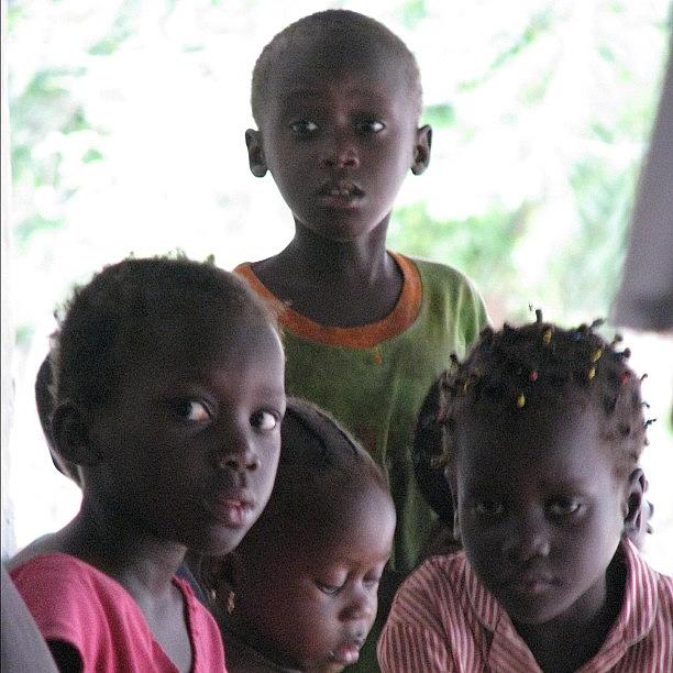 Cool Photograph - #kids #gambia #compound #sad #expression by Robin Boer