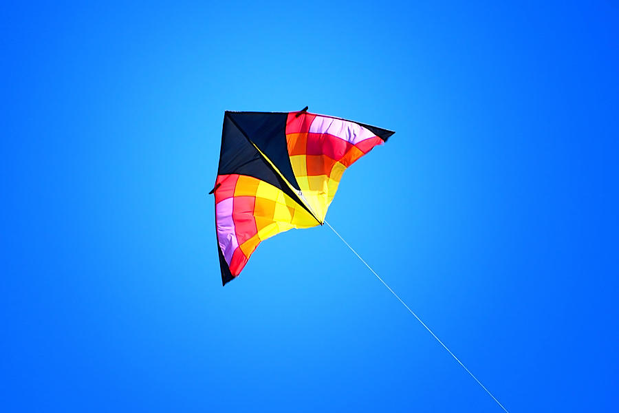 Kite Flying High In Blue Sky Photograph by Tracie Schiebel