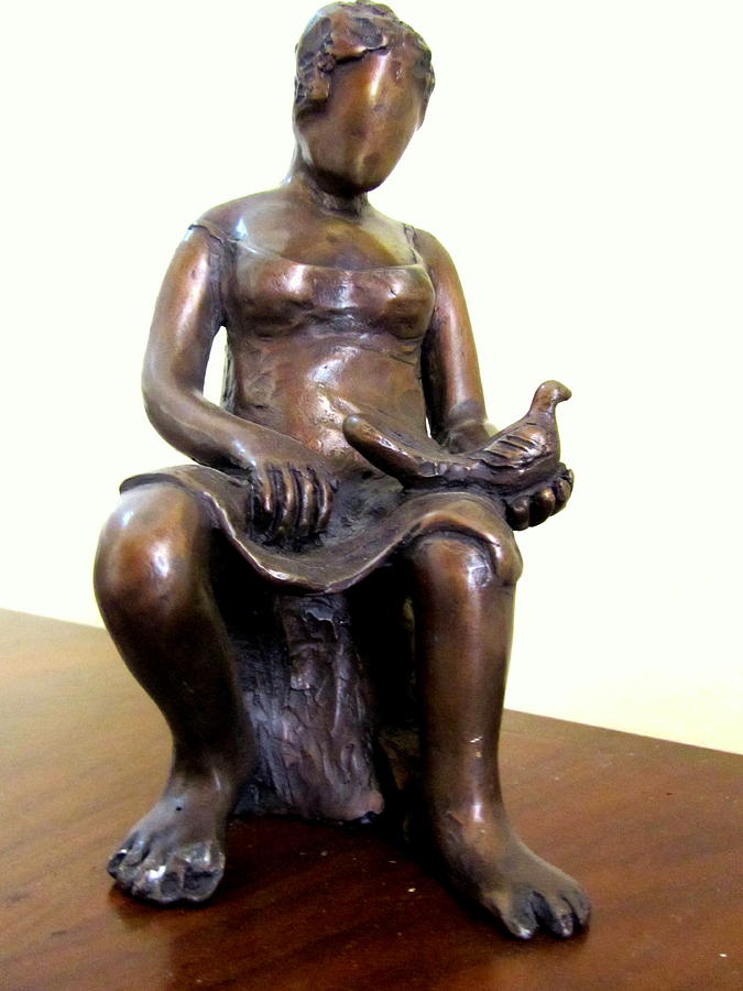 Lady Bird Bronze sculpture of a woman sitting holding a bird with a dress face blurred strong legs Sculpture by Rachel Hershkovitz