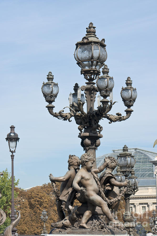 Lamppost and statues on the bridge Alexandre III in Paris Photograph by Fabrizio Ruggeri
