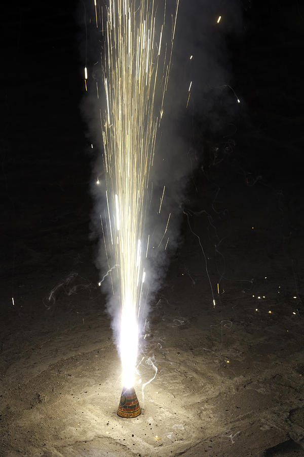 Large amount of sparks from a conical firecracker during Diwali celebrations Photograph by Ashish Agarwal