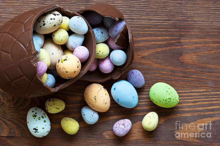 Easter Photograph - Large chocolate easter egg full of small candy by Richard Thomas