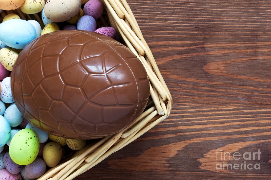 Easter Photograph - Large chocolate easter egg in a basket by Richard Thomas