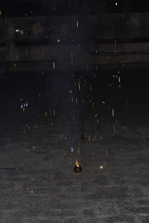 Last set of sparks from a firecracker during Diwali celebrations Photograph by Ashish Agarwal