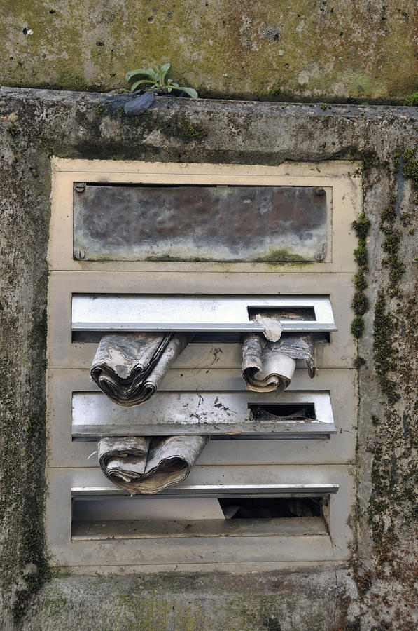 Letterbox with old newspapers Photograph by Matthias Hauser