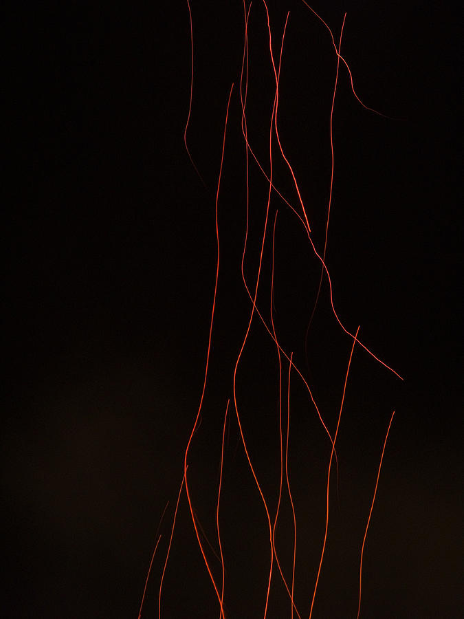 Light waves created by a fire cracker on a dark night Photograph by Ashish Agarwal