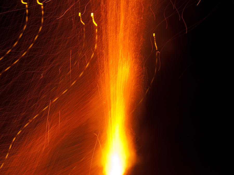 Light waves dancing around the flames of a fire cracker Photograph by Ashish Agarwal