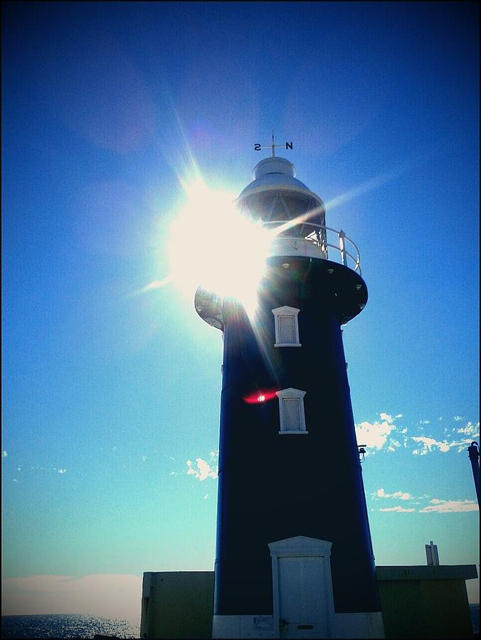 Lighthouse In The Sunlight Photograph by Roberto Gagliardi