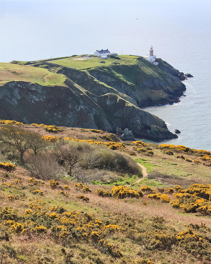 Lighthouse on Howth Cliffs Photograph by Semmick Photo