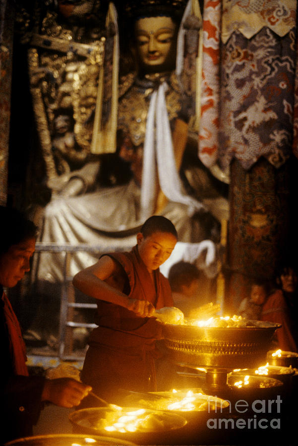 Lighting Puja Candles - Jokhang Temple Tibet Photograph by Craig Lovell
