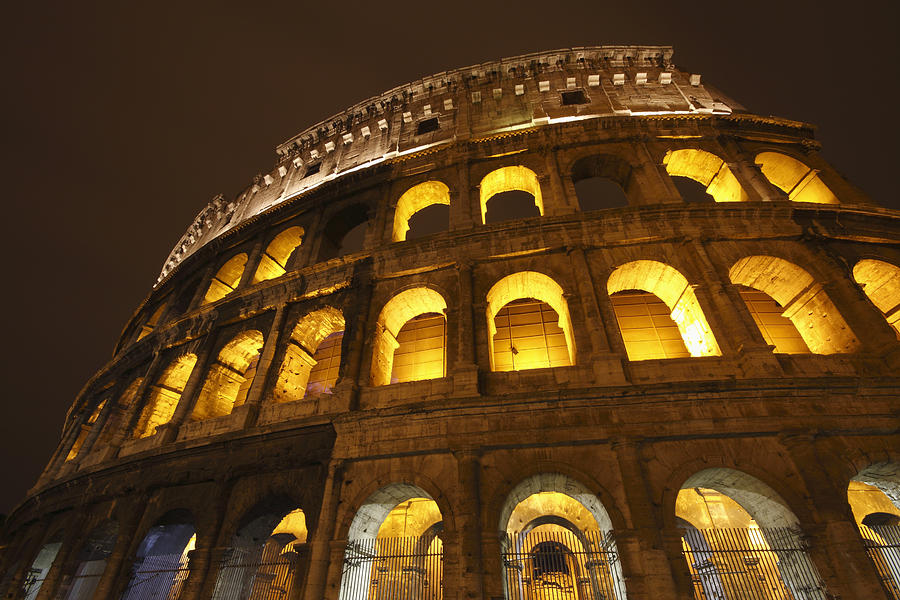Lights Of The Colosseum Photograph by Trish Punch