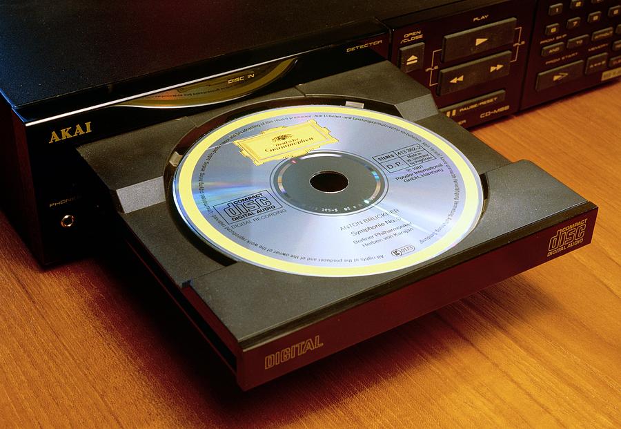 Compact Disc Player Photograph - Loading A Compact Disc Into Compact Disc Player by David Parker