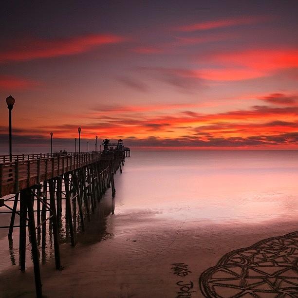 Long Exposure Sunset At The Oceanside Photograph by Larry Marshall