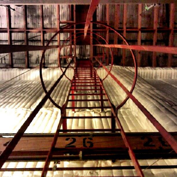 Architecture Photograph - Looking Up The Down Ladder On Stage by Christi Evans