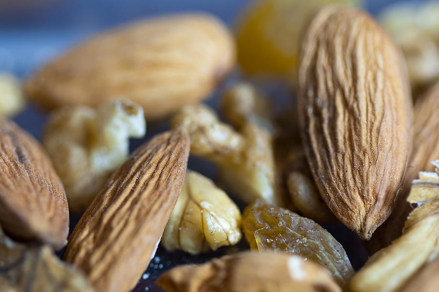 Macro shots of various dry fruit items such as Almonds and Walnuts and Raisins Photograph by Ashish Agarwal