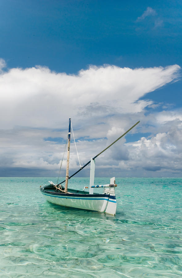 Maldivian Boat Dhoni on the Peaceful Water of the Blue Lagoon Photograph by Jenny Rainbow