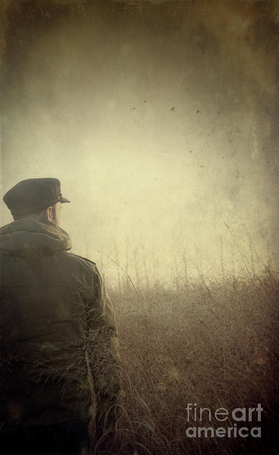 Fall Photograph - Man alone in Autumn field by Sandra Cunningham