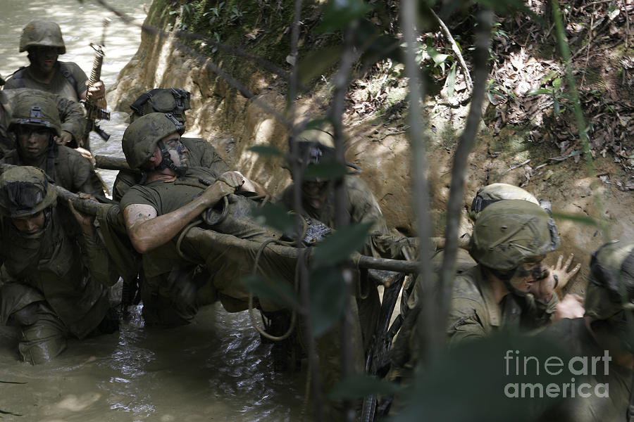 Marines Trudge Through The Mud Photograph by Stocktrek Images